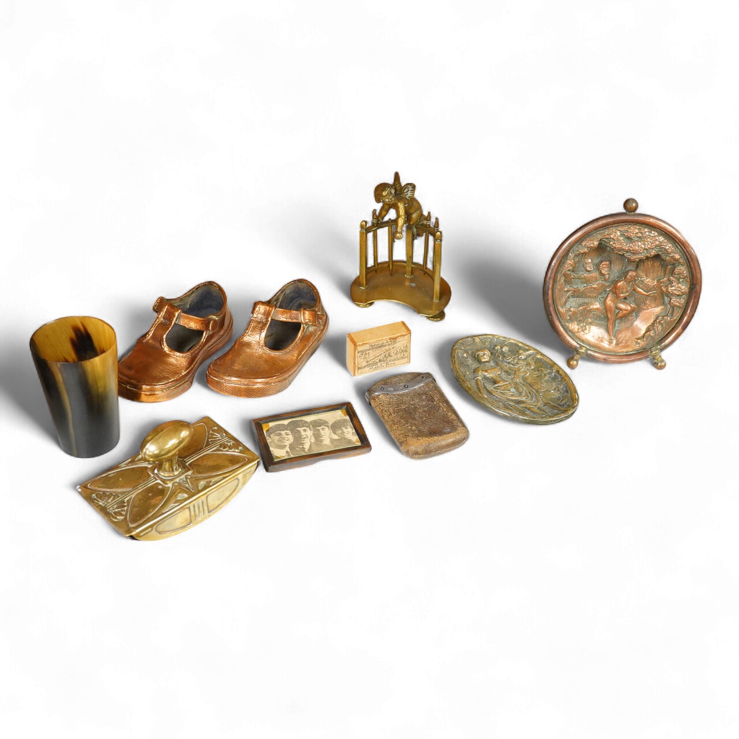 A collection of mixed metalware to include a copper plaque and brass ink blotter, together with a horn beaker